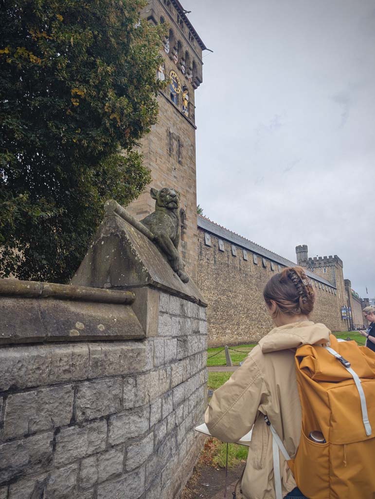 A women with a yellow backpack on drawing